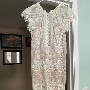 White lace dress, cocktail length, nude underlay